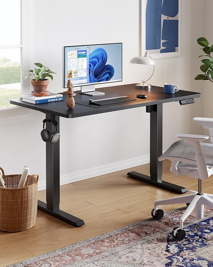 HUANUO 55" x 24" Electric Standing Desk Adjustable Height, 4 Memory Height Settings, Headphone Hook, Cable Manager, Sit Stand Up Desk for Home Office & Computer Workstation, Black